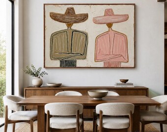 May include: A rectangular wall art piece featuring two stylized figures wearing wide-brimmed hats. The left figure is rendered in shades of brown and olive green, while the right figure is in shades of pink. Both figures have arms crossed.