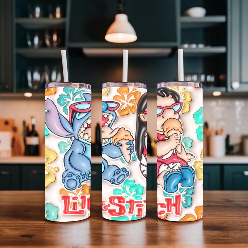 May include: Three stainless steel tumblers with white straws. Each tumbler features a colorful cartoon design of characters from the movie "Lilo & Stitch", with the words "Lilo & Stitch" in red and white. The background includes floral and tropical elements.