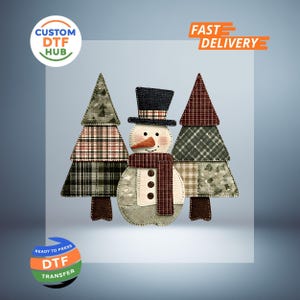 May include: A snowman and two Christmas trees made of fabric patches. The snowman has a carrot nose, a black top hat, and a scarf. The trees and snowman are on a light blue background. The image includes the text "Custom DTF Hub" and "Fast Delivery".