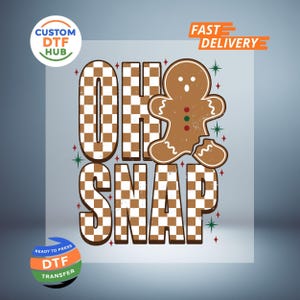 May include: A DTF transfer design with the words "OH SNAP" in a brown and white checkered pattern, with a gingerbread man graphic. The design includes red and green accents and the words "FAST DELIVERY" and "READY TO PRESS DTF TRANSFER".