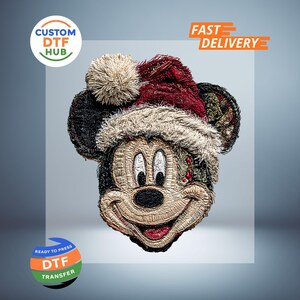 May include: DTF transfer of Mickey Mouse wearing a Santa hat. The image features a smiling Mickey with a red and white hat. The text "CUSTOM DTF HUB" and "READY TO PRESS DTF TRANSFER" are also visible.