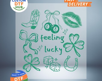 May include: Green graphic DTF transfer with a cowboy boot, cherries, lips, shamrocks, dice, horseshoe, and the words "feeling lucky". Includes logos for "Custom DTF Hub" and "Ready to Press DTF Transfer".