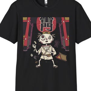 May include: A black short-sleeve t-shirt featuring a graphic print of a stylized character in traditional Japanese attire standing beneath a large red lantern with the kanji characters 雷門. The design includes architectural elements and small icons.