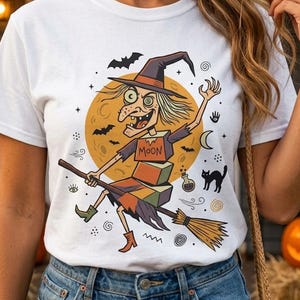 Camiseta Unissex de Bruxa | Estampa Retrô de Halloween | Camiseta com Estampa de Vassoura Voadora | Camiseta Vintage de Bruxa