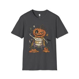 Camiseta Unissex com Estampa de Abóbora | Estampa de Abóbora de Halloween | Camiseta com Estampa de Colheita de Outono | Camiseta Assustadora com Abóbora Dark Heather