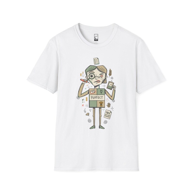 May include: A white short-sleeved t-shirt featuring a graphic illustration of a character holding a magnifying glass and a small picture frame. The character has a box-shaped torso with the word PERFECT printed on it and a 98% NOT GOOD ENOUGH note.