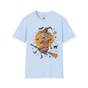 Unisex Witch T-Shirt | Retro Halloween Print | Flying Broomstick Graphic Tee | Vintage Witch T-Shirt Light Blue
