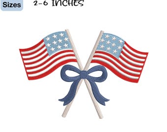 May include: Embroidery design featuring two American flags crossed with a blue bow. The flags have red and white stripes and a blue field with white stars. The design is available in 5 sizes, ranging from 2 to 6 inches.