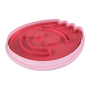 May include: A two-tone pink cookie cutter in the shape of a smiling face. The inner portion is a darker shade of pink, with the facial features raised. The outer rim is a lighter pink.
