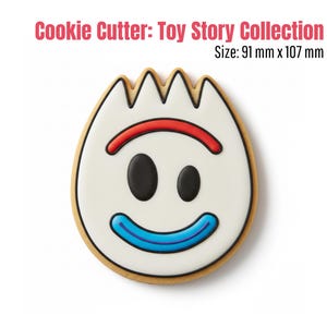 May include: A cookie cutter in the shape of the Toy Story character Forky. The cookie cutter has a white face with black oval eyes, a red curved line above the eyes, and a blue curved line for a smile. The cookie cutter is 91 mm x 107 mm.