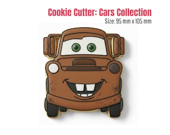 May include: A brown cookie cutter in the shape of a cartoon car with a smiling face and green eyes. The cookie cutter is part of the "Cars Collection" and measures 95 mm x 105 mm.