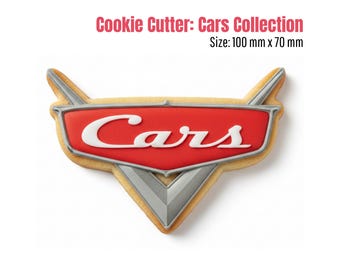 May include: A Cars-themed cookie cutter in the shape of the Cars logo. The cookie cutter is red with white lettering and silver accents. The text "Cookie Cutter: Cars Collection" and size 100 mm x 70 mm are displayed.
