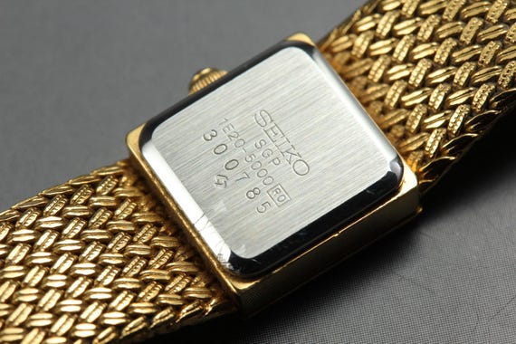 Vintage 1993 *near mint* seiko 1e20-5000 13mm gold sq… - Gem