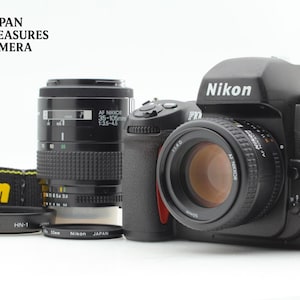 2 objectifs *état neuf* Nikon F100 AF 50 mm f/1.4D + 35-105 mm f/3.5-4.5, importés du Japon