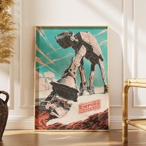 May include: A framed poster featuring a vintage-style illustration of an AT-AT walker from Star Wars: The Empire Strikes Back. The artwork has a teal and red color scheme, with the text "THE EMPIRE STRIKES BACK" at the bottom.