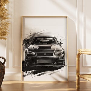 May include: Black and white framed art print of a sports car. The artwork features a detailed illustration of the car with a dynamic, brushstroke-style background. The car is centered, showcasing its front profile.