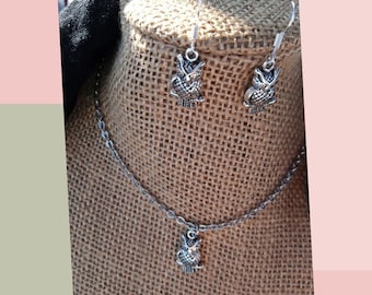 Set of silver colored owl necklace and earrings