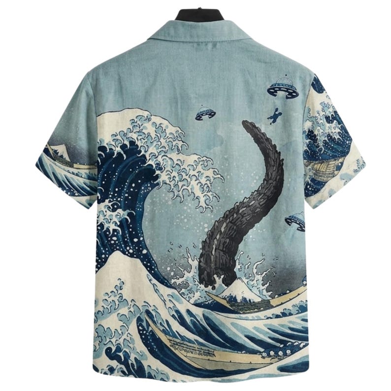 May include: Short-sleeved button-up shirt with a light blue background and a Japanese-inspired wave design. The design includes a large wave, a dark creature, boats, and flying saucers. The shirt has a classic collar and a relaxed fit.