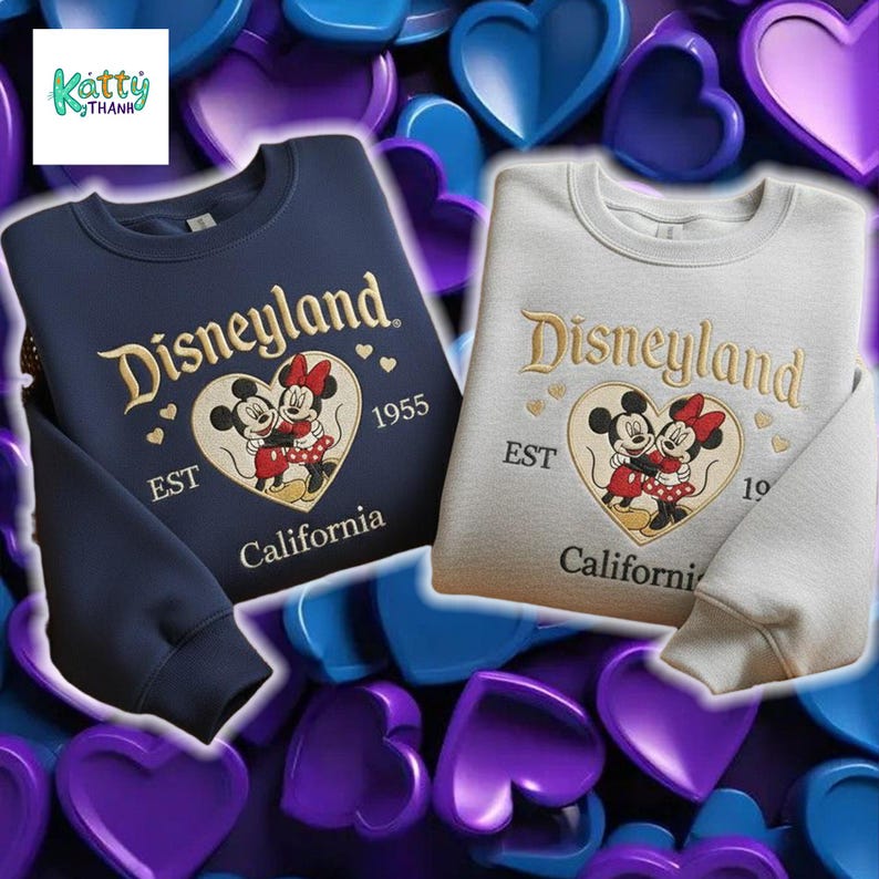 two sweatshirts with the Disney theme park logo, Minnie Mouse and Mickey Mouse, against a background of hearts in various colors.