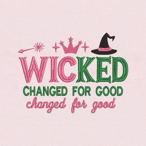 May include: Pink embroidered text on a light pink background. The word "WICKED" is in pink and green, with a witch hat, crown, and wand above it. Below, the text reads "CHANGED FOR GOOD" in green, and "changed for good" in pink.