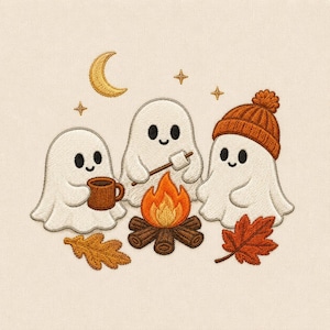 May include: An embroidery design featuring three white ghosts sitting around a campfire. One ghost holds a brown mug, another holds a marshmallow on a stick, and the third wears an orange knit hat. Includes a yellow crescent moon and two leaves.