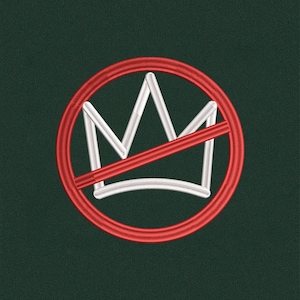 May include: Embroidered patch featuring a white crown design inside a red circle with a red diagonal line through it. The patch is on a dark green background.