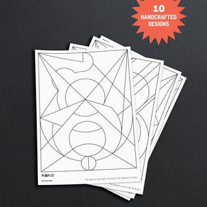 May include: A stack of white cards with geometric line art designs. The cards have text that reads "Komorebi", "The play of sunlight through the leaves of trees", and "The gleam on a river at dusk". A red burst shape with the text "10 HANDCRAFTED DESIGNS" is in the upper right corner.