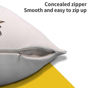 May include: Close-up of a white pillow with a concealed zipper. The text reads "Concealed zipper Smooth and easy to zip up". The pillow has a textured surface and a yellow and white background.