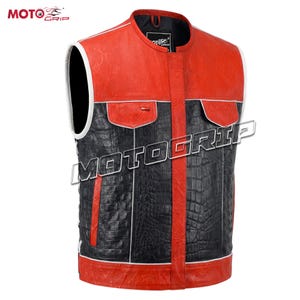 May include: A red, black, and white leather vest with a textured pattern. The vest has a mandarin collar, two front pockets, and the text "MOTOGRIP" across the front. The vest is sleeveless.