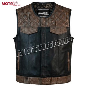 May include: A black leather vest with brown snake-skin textured accents. The vest features a quilted pattern on the shoulders and two front pockets. The brand name "MOTOGRIP" is displayed prominently across the front.