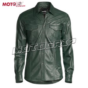 May include: A dark green leather shirt with long sleeves, two chest pockets, and a button-down front. The shirt has a classic collar and is branded with the "MOTOGRIP" logo. The shirt is designed for motorcycle enthusiasts.