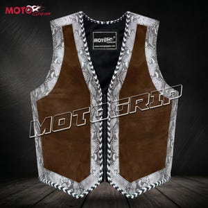 May include: A white ceramic mug with a black handle and the text "But First, Coffee" in a bold, black font. The mug is set against a blurred background, suggesting a cosy setting.