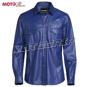 May include: A blue leather shirt with a button-down front, two chest pockets, and a collared neckline. The shirt has long sleeves and the brand name "MOTOGRIP" is displayed across the front.