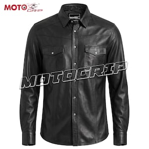 May include: Black leather shirt with long sleeves, two chest pockets, and snap closures. The shirt has a classic collar and the text "MOTOGRIP" is displayed across the front. A stylish and durable garment.