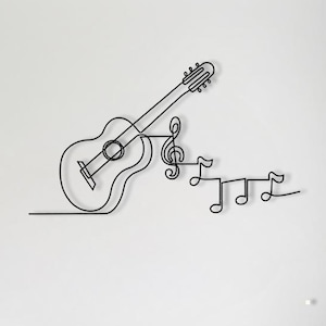 May include: A black metal wall art piece showing a guitar and musical notes. The guitar is designed with a continuous line, with a treble clef and notes alongside it. The artwork is mounted on a white wall, suitable for a music room.