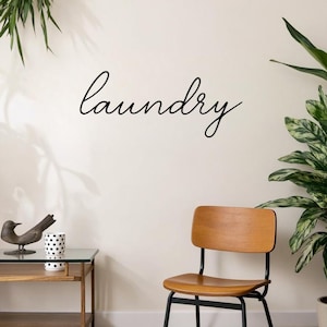 May include: A handmade, wooden cutting board with a natural finish. The board features a live edge on one side and a rectangular shape. It is approximately 18 inches long and 12 inches wide.