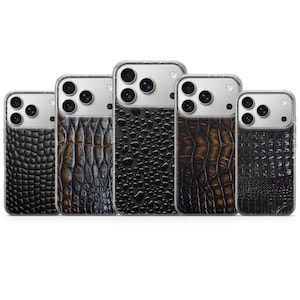Peut inclure: Cinq coques de smartphone alignées, chacune présentant un panneau arrière texturé distinct. Les motifs incluent des textures de peau de crocodile noire et brune ainsi qu'une texture noire granuleuse. Chaque coque a une découpe claire.