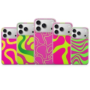 May include: Five smartphone cases arranged in a row, each featuring a distinct pattern in vibrant neon pink and lime green. The designs include wavy lines, organic blobs, and abstract shapes, all surrounding the camera lens cutouts on the back.