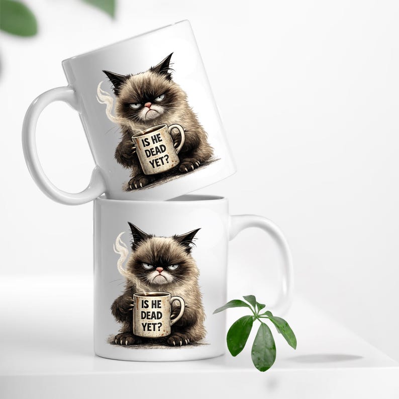 May include: Two white ceramic mugs with a grumpy cat design. The cat is brown and black, holding a mug with the text "IS HE DEAD YET?". The mugs are stacked, with one slightly tilted.