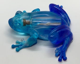 Blue and white resin frog, with a message in the bottle