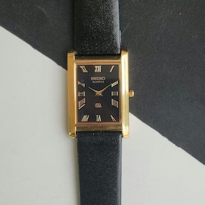 Vintage renoverad Seiko Slim Quartz Black Watch 26 MM Rektangulär Herrklocka