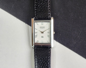 Odnowiony, zabytkowy zegarek męski Seiko Slim Quartz z białą tarczą, 26 mm, prostokątny