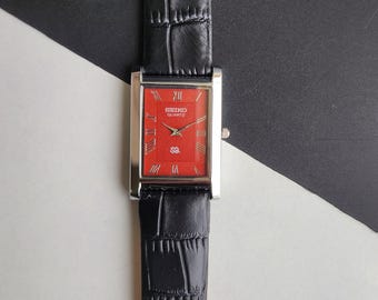 Odnowiony, zabytkowy zegarek męski Seiko Slim Quartz Red Face 26 mm, prostokątny