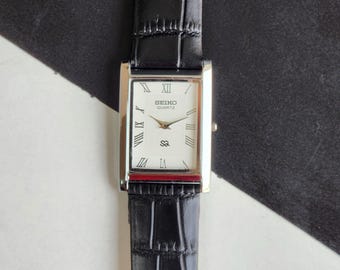 Odnowiony, zabytkowy zegarek męski Seiko Slim Quartz z białą tarczą, 26 mm, prostokątny