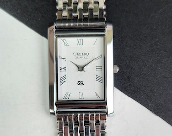 Odnowiony, zabytkowy zegarek męski Seiko Slim Quartz z białą tarczą, 26 mm, prostokątny