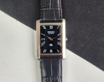 Odnowiony, zabytkowy zegarek męski Seiko Slim Quartz z czarną tarczą, 26 mm, prostokątny