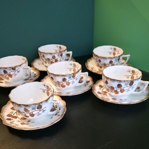 Vintage 12-Piece Porcelain Tea / Coffee Set for 6 — Forest Pinecone Motif, Sponge Gold Rims (1 Cup Cracked)