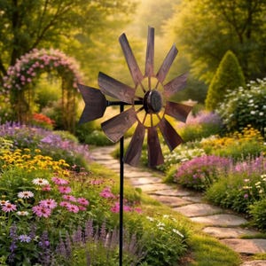 May include: A metal windmill garden spinner featuring a dark brown, weathered finish with twelve radiating blades and a directional tail fin, mounted on a thin black vertical pole, designed to rotate in the wind as a decorative outdoor kinetic sculpture.