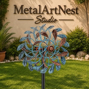 May include: A dual-rotor metal wind spinner featuring two circular arrays of leaf-shaped blades. The blades are finished in alternating metallic blue and copper tones, mounted on a central vertical black pole with a decorative copper-colored hub.