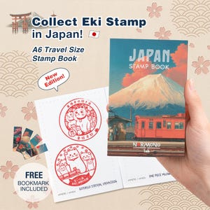 May include: An A6 travel size stamp book featuring a cover illustration of Mount Fuji and a red train. The book includes red ink stamp impressions of cats and Japanese text. A set of small bookmarks is included with the stamp book set.